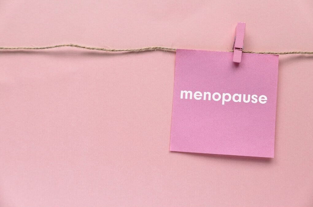 Pink menopause card representing hormonal changes linked with migraine during perimenopause.