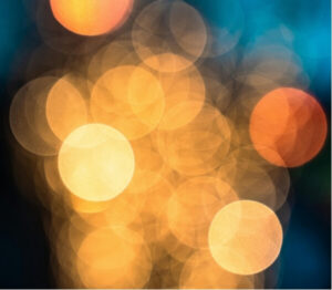 Blurred lights illustrating visual sensitivity associated with migraine prodrome symptoms